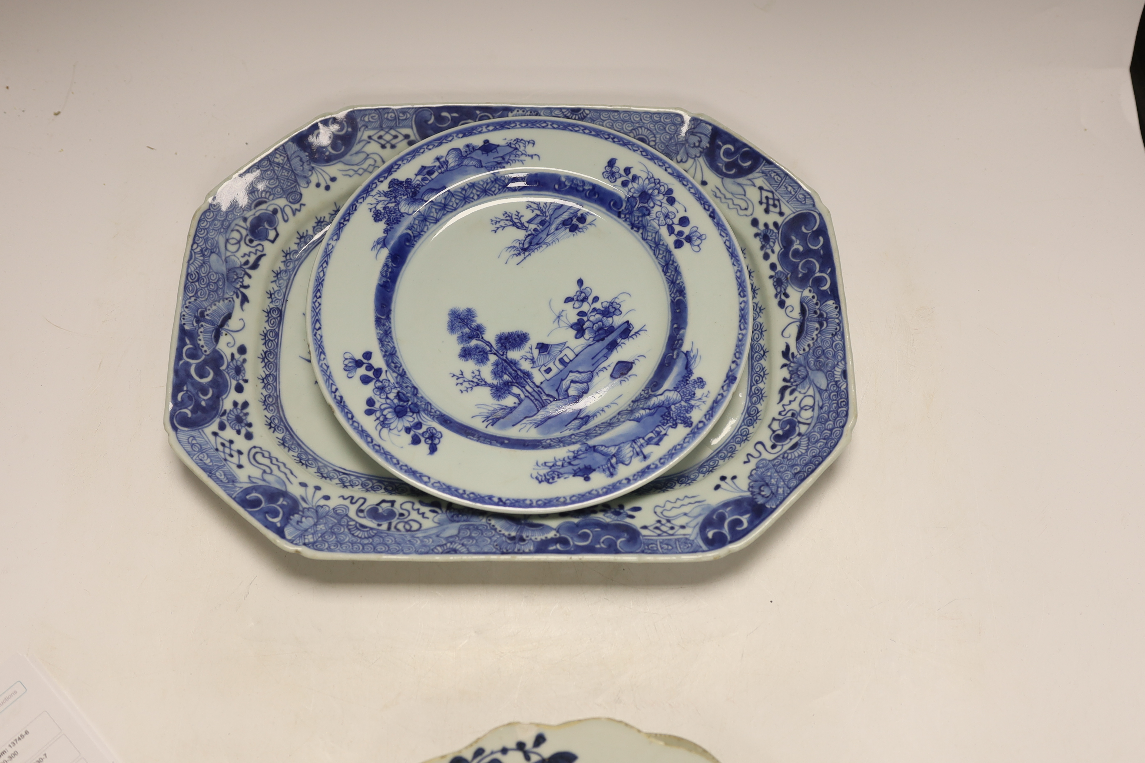 A Chinese blue and white meat plate and three plates, 18th century, meat plate 35cm wide